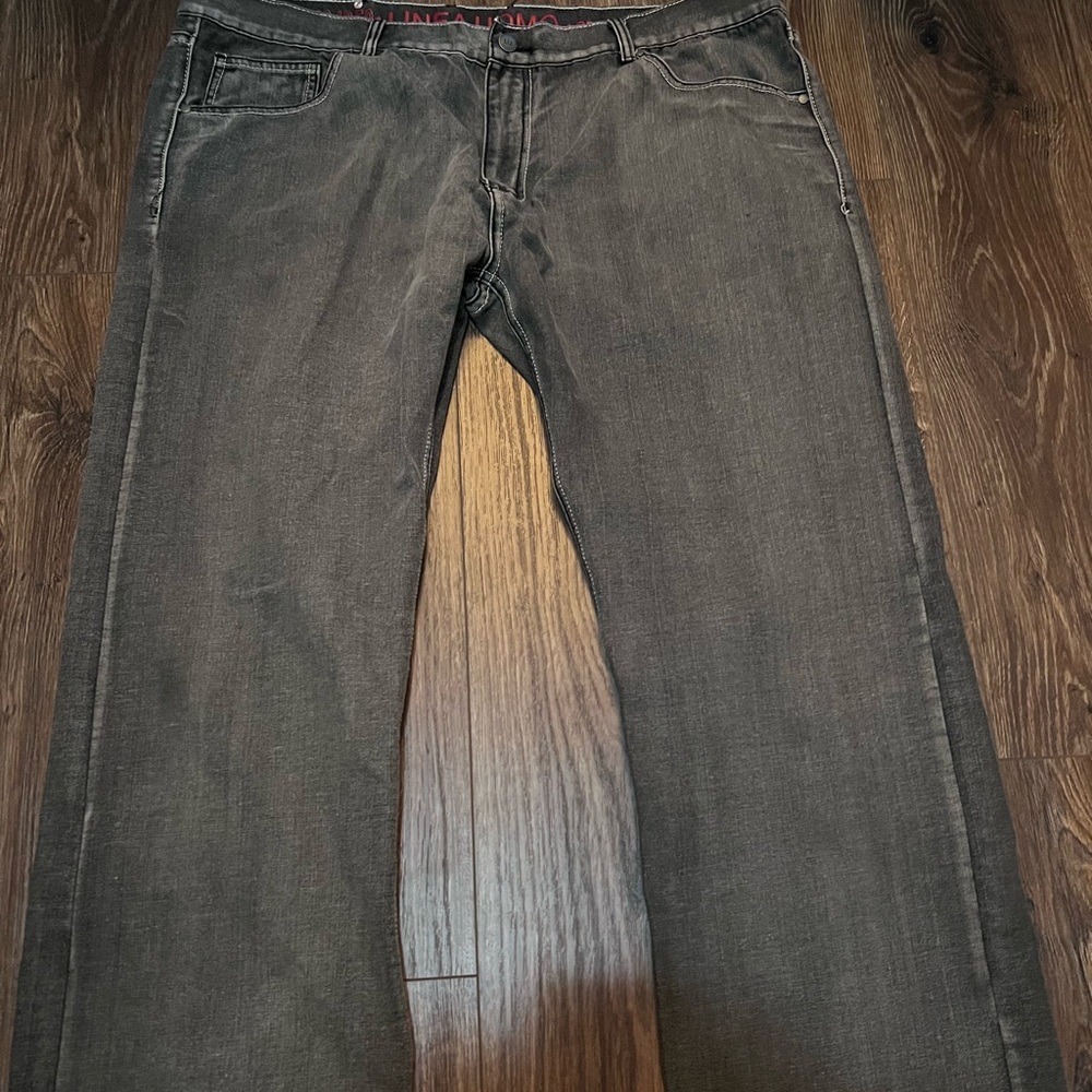 Grey and black jeans with red pockets